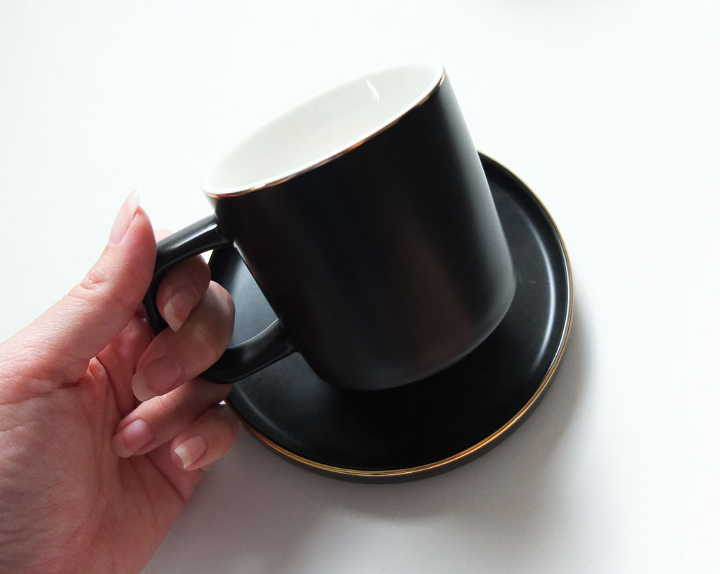 black mug with gold rim
